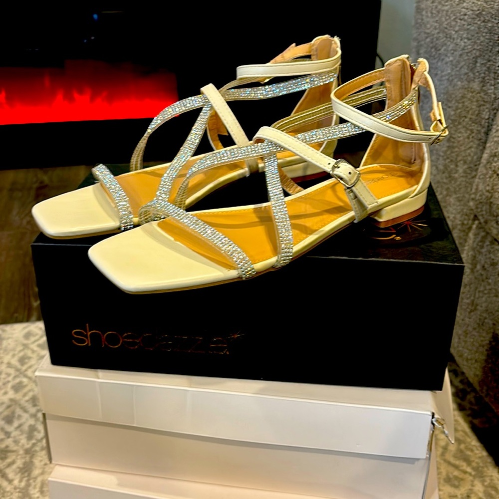 Selling “new” cream sparkling flat sandals. (Never worn)